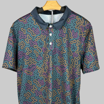 Short-sleeve shirt with a colorful pattern on a wooden hanger against a white background