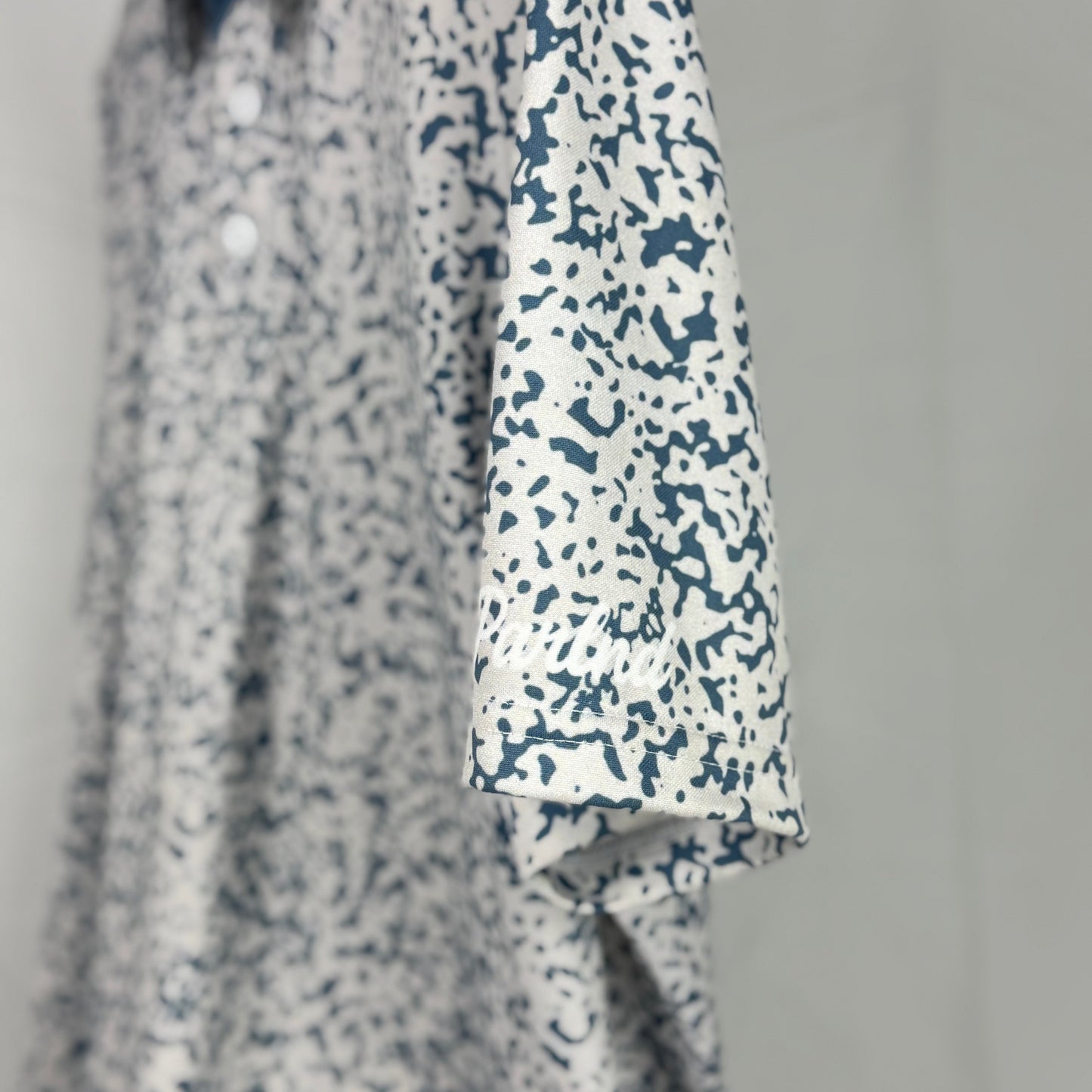 Floral patterned shirt with a plain background