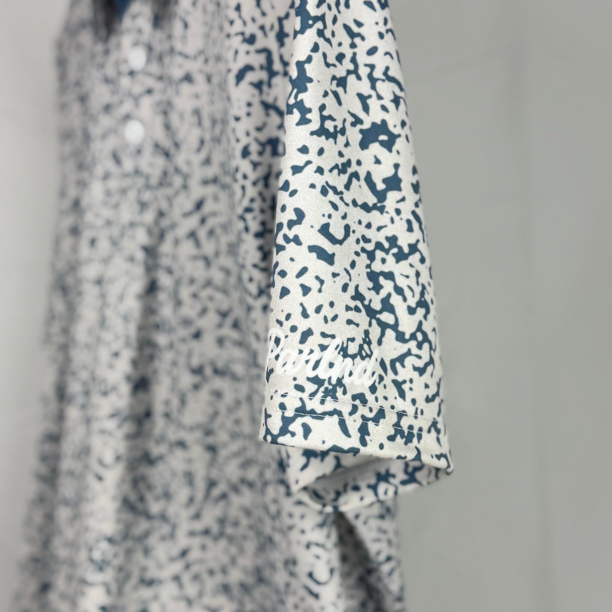 Floral patterned shirt with a plain background