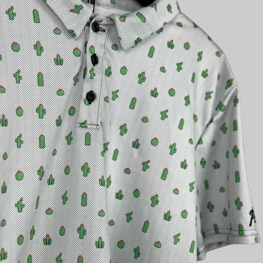 White polo shirt with green cactus pattern on a gray background