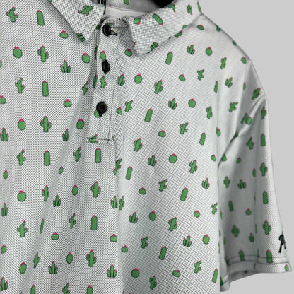White polo shirt with green cactus pattern on a gray background