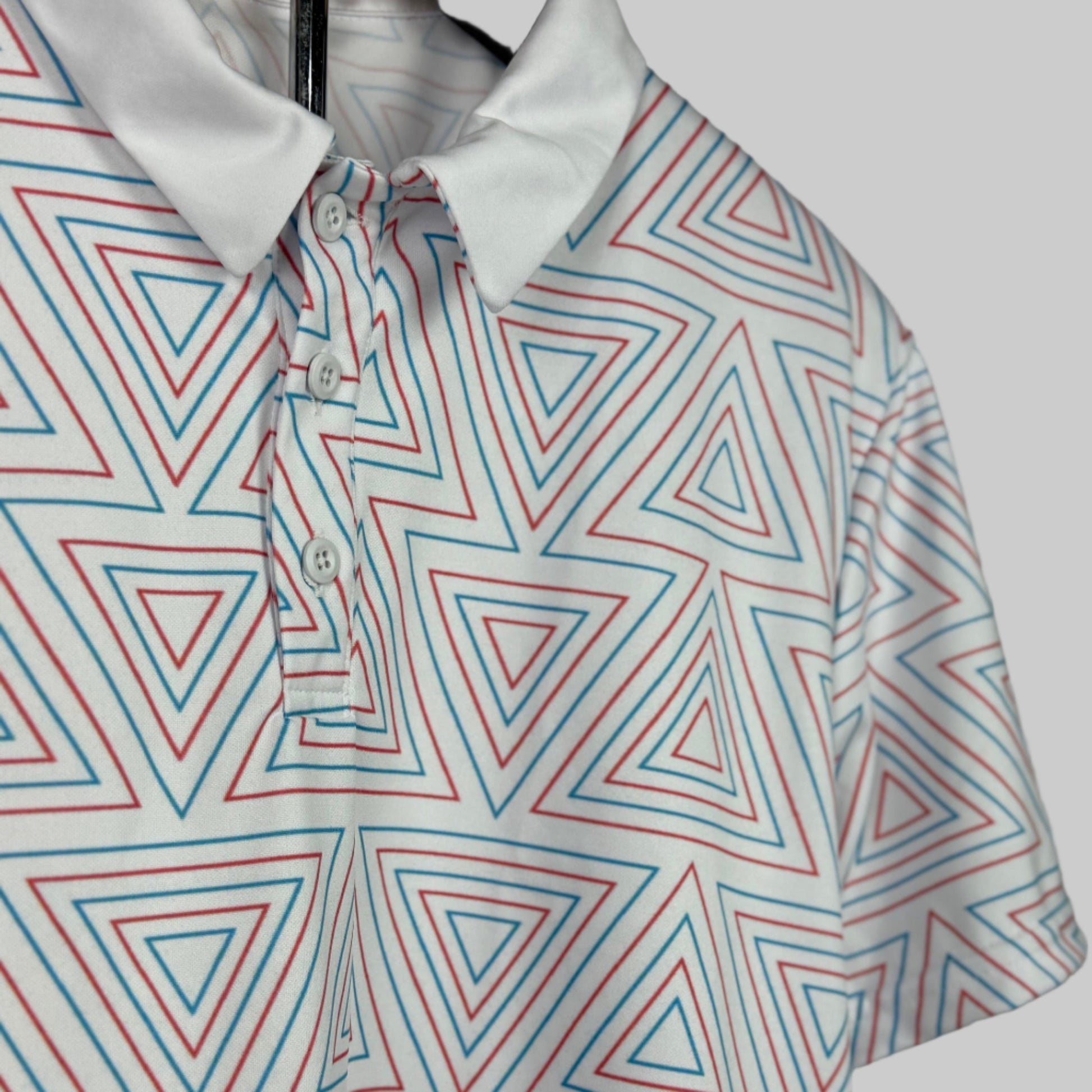 Geometric patterned shirt with red and blue triangles on a white background